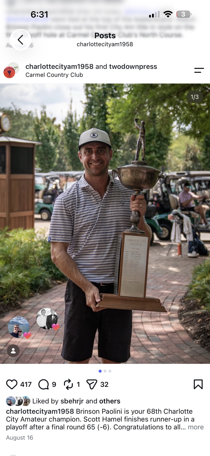 Brinson Paolini holding the championship trophy